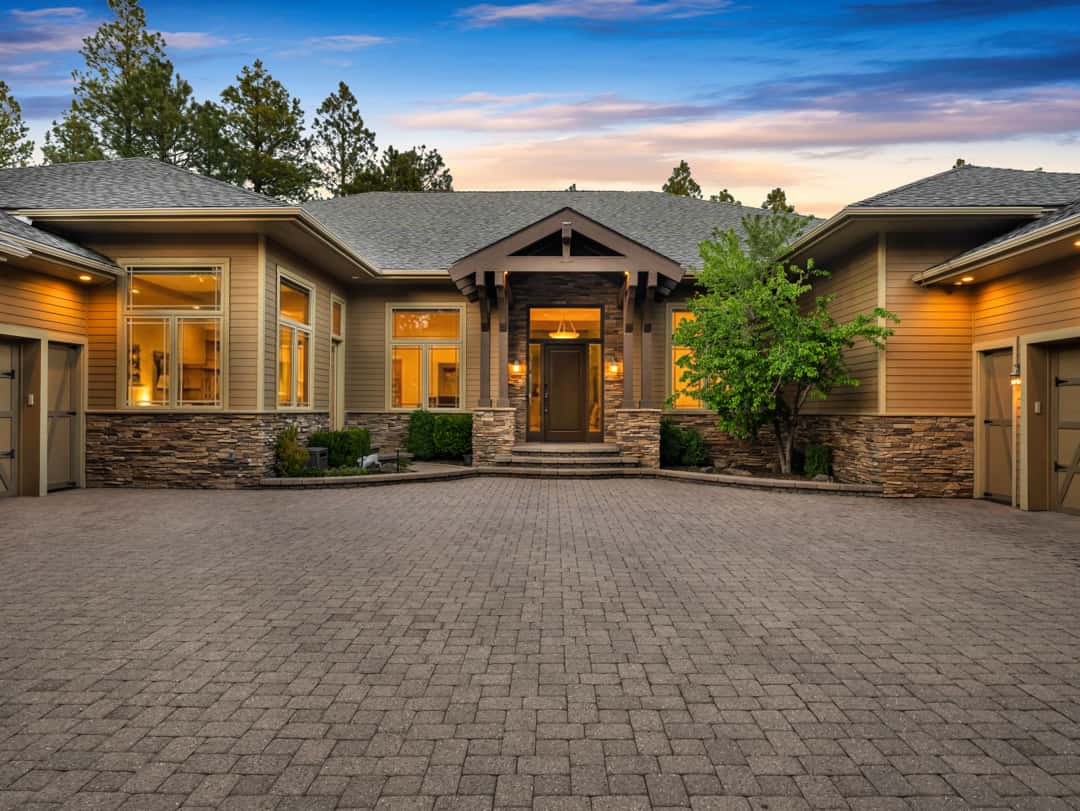 3 of 52. Large paver motor court with extensive guest parking, custom garage spaces, and refined mountain architecture designed for upscale living in Flagstaff.
