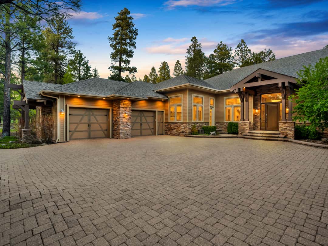 4 of 52. Spacious luxury garage setup featuring multiple heated bays, EV charging capability, and custom finishes ideal for vehicles, storage, and mountain lifestyle needs.