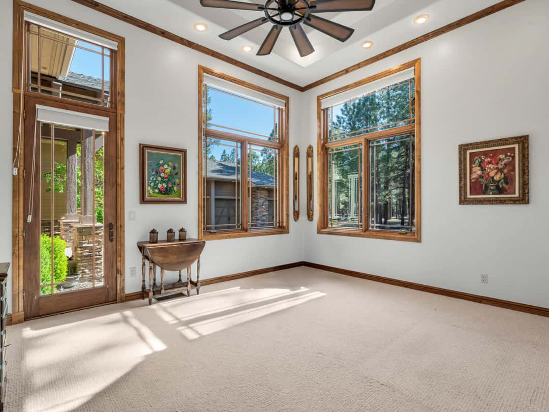 26 of 52. Bright bedroom with soaring ceilings, expansive windows, and clean modern finishes creating a peaceful and comfortable mountain living environment.