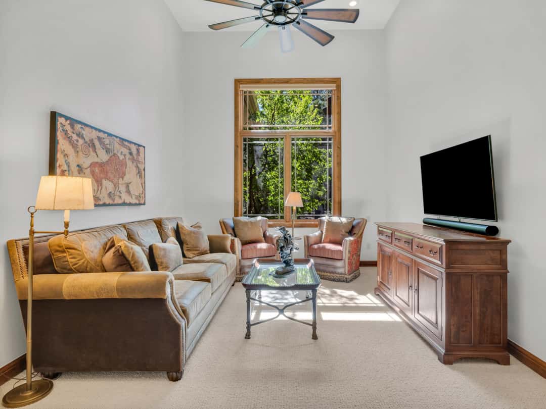 30 of 52. Dedicated office or flex room featuring vaulted ceilings, oversized windows, and a quiet sitting area ideal for working from home in Flagstaff.