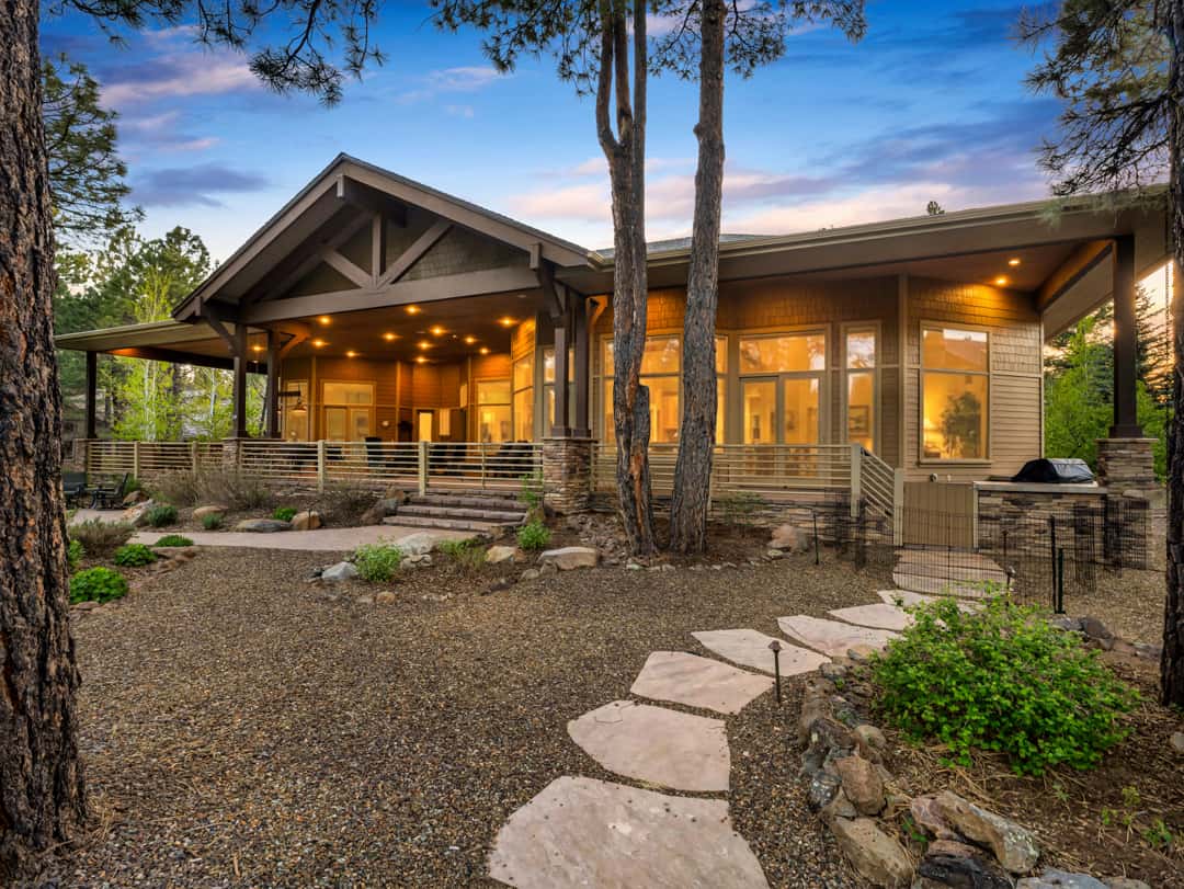 38 of 52. Luxury estate positioned on over an acre of beautifully landscaped property surrounded by mature pines, offering exceptional privacy and outdoor living space.