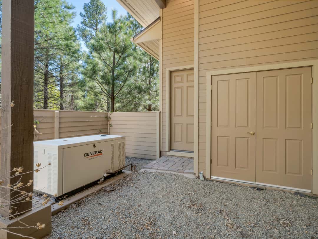 48 of 52. Reliable Generac generator system offering enhanced energy security and backup power support for this luxury Flagstaff property.