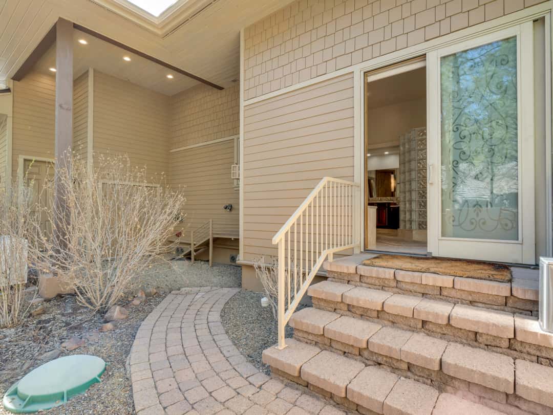 49 of 52. Private outdoor pet area with paved walkways, easy access, and low-maintenance landscaping designed for convenience and comfort in Flagstaff.