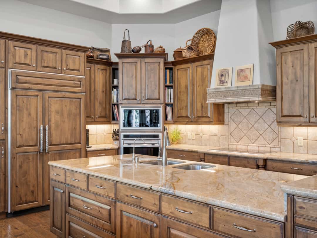 11 of 52. Stunning gourmet kitchen with custom cabinetry, oversized island, double ovens, and luxury finishes perfect for entertaining and upscale mountain living in Flagstaff.