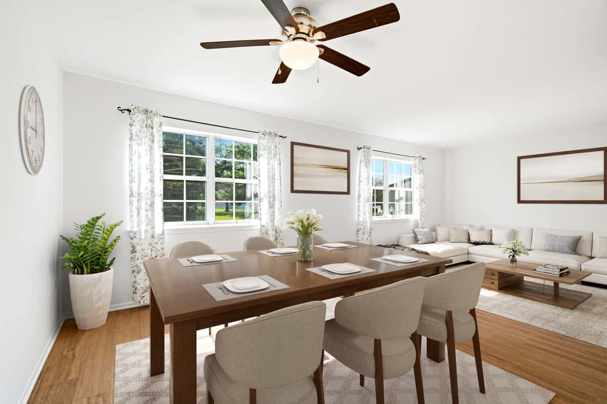 14 of 39. Bright and inviting dining area featuring large windows, modern furnishings, and a spacious layout perfect for gatherings.