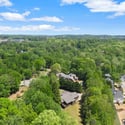 Explore this expansive lot surrounded by lush greenery, offering a perfect blend of nature and community.