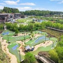 Discover this unique property featuring expansive greens and recreational areas, perfect for outdoor enthusiasts and families.