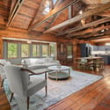Experience rustic warmth in this spacious, open-concept living area with inviting natural light and stunning wood accents.
