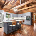 Spacious kitchen featuring modern appliances, ample storage, and stunning wood accents for a welcoming atmosphere.