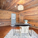 Bright office space featuring natural wood accents, modern lighting, and a welcoming atmosphere for productivity.