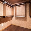 Expansive walk-in closet with ample shelving and storage options, perfect for organizing your wardrobe efficiently.