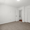 Spacious, well-lit room featuring neutral tones and ample storage options, perfect for your personal touch.