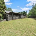 This inviting home features a spacious yard, perfect for outdoor activities and gatherings.