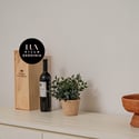 Discover modern decor featuring local wines and tasteful accents, perfect for creating a welcoming atmosphere.