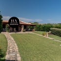 Discover a unique villa in Sardinia surrounded by lush gardens and stunning panoramic views.