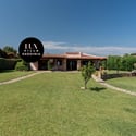 Spacious villa in Sardinia, surrounded by lush gardens and scenic views, perfect for relaxation and gatherings.