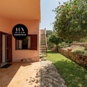 Discover this inviting villa with lush gardens and unique outdoor spaces, perfect for relaxation and gatherings.