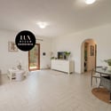 Bright, open living space seamlessly connects to a private outdoor area, perfect for relaxing and entertaining.