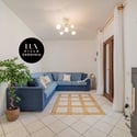 Bright living area featuring a spacious layout, modern decor, and a welcoming atmosphere for relaxation.