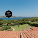 Stunning waterfront villa in Sardinia, featuring expansive views and beautifully landscaped gardens. Ideal for relaxation and entertaining.