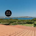 Stunning villa offers breathtaking sea views and expansive outdoor spaces surrounded by lush greenery.