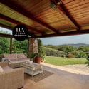 Relaxed outdoor living space seamlessly connects with lush surroundings, perfect for entertaining and enjoying nature.