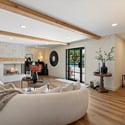 Stylish living area anchored by a custom fireplace, neutral tones, and abundant natural light for comfortable everyday living in Phoenix.