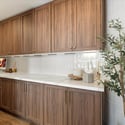 Stylish bonus room with built-in storage and wood flooring, ideal as a home office, studio, or flexible living space.