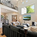 Stunning great room with vaulted ceilings, loft-style overlook, and modern finishes that create an open and inviting atmosphere.