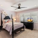 Spacious guest bedroom featuring neutral finishes, ceiling fan, and flexible layout ideal for guests, office, or hobbies.