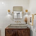 Thoughtfully designed powder room featuring statement vanity, modern lighting, and upscale finishes for guests.
