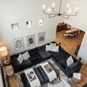 Loft perspective showcasing open sightlines to the great room, high ceilings, and the home s airy architectural layout.