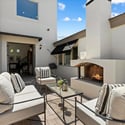 Outdoor entertaining area with fireplace, lounge seating, and easy access to the home s interior living spaces.