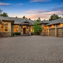 Extraordinary custom estate on an acre-plus homesite in Forest Highlands featuring luxury mountain design, stone accents, and breathtaking golf course surroundings in Flagstaff.