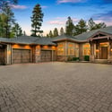 Spacious luxury garage setup featuring multiple heated bays, EV charging capability, and custom finishes ideal for vehicles, storage, and mountain lifestyle needs.