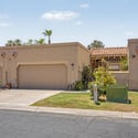 Beautiful front fa ade with a private courtyard entrance, garage parking, and mature greenery. The thoughtfully designed exterior reflects the easy-care lifestyle buyers seek in Scottsdale real estate.