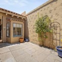 Private courtyard retreat featuring ample patio space for outdoor seating, gardening, and entertaining. This secluded outdoor area enhances the home's indoor-outdoor lifestyle appeal.