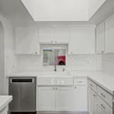 Stylish kitchen featuring a farmhouse sink, modern finishes, extensive cabinetry, and stainless steel appliances. Natural light and clean design elements make this space both beautiful and practical.