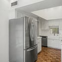 Spacious kitchen with updated appliances, ample storage, and generous counter space for meal preparation. The efficient layout supports both everyday living and entertaining needs.