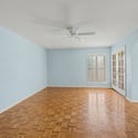 Spacious primary suite featuring plantation shutters, ceiling fan, and private patio access. This comfortable retreat offers a quiet place to unwind after enjoying Scottsdale's nearby amenities.