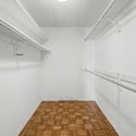 Roomy walk-in closet featuring extensive hanging space and practical storage solutions. A valuable feature that helps maximize organization within the primary suite.