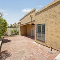 Expansive patio area offering privacy, mature greenery, and flexible outdoor living options. Perfect for dining, entertaining, gardening, or relaxing in the Scottsdale sunshine.