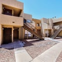 Exterior view highlighting the clean, attractive community design, landscaped walkways, and easy access to the home. Residents enjoy a pool, fitness center, and convenient proximity to everyday amenities.