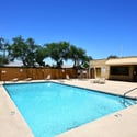 Community recreation area featuring a sparkling swimming pool, relaxing spa, and ample deck space. Residents enjoy convenient access to resort-style amenities year-round.