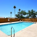 Beautiful community pool surrounded by lounge seating and open sky views. This sought-after amenity provides an excellent place to cool off and unwind.