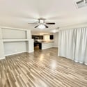 Comfortable living area with durable flooring, neutral finishes, and open sightlines throughout the main living spaces. Perfect for relaxing or hosting friends and family.