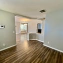 Open flex room with attractive flooring and seamless flow into the main living areas. Perfect for a home office, hobby room, study area, or additional lounge space.