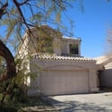Side-angle exterior view highlighting mature landscaping, attractive curb appeal, and a desirable cul-de-sac location. This Glendale property offers privacy, comfort, and community amenities.