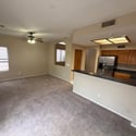 Functional kitchen featuring extensive cabinetry, a breakfast bar, and ample countertop space. Designed to keep you connected to guests while preparing meals.