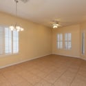 Spacious front living and dining area enhanced by natural light and classic plantation shutters. Tile flooring throughout provides easy maintenance and timeless style.